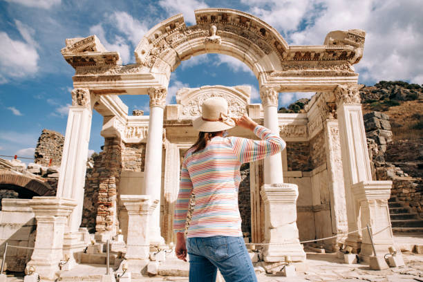 young woman visiting temple of hadrian in ephesus ancient city - turkey tourist ephesus roman imagens e fotografias de stock