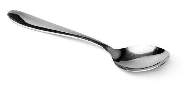 istock Silver spoon isolated on white background close up 1300075953