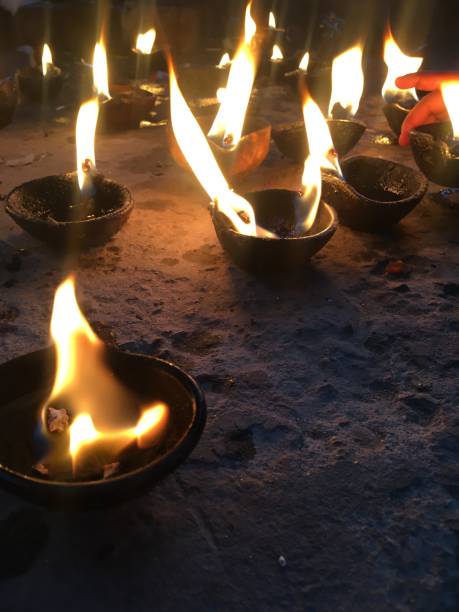istock Group of lit clay lamp 1300076612