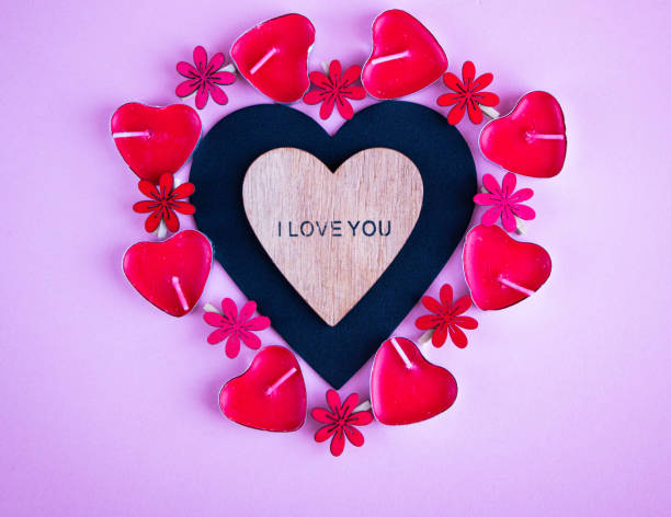 istock chalk board in shape of  heart for copying space or writing congratulation text, with various red and pink accessories in  shape of  heart, for  postcard or congratulations on Valentines Day 1300077484