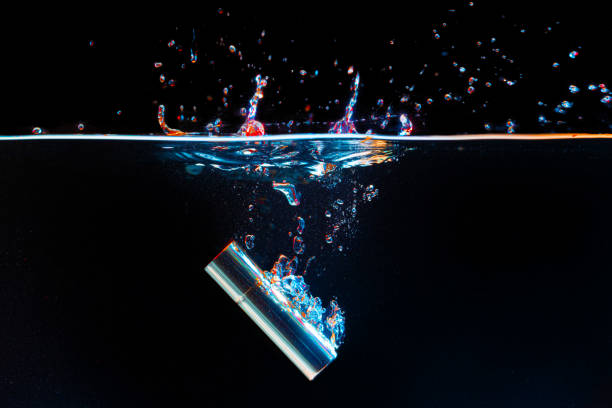 istock Lipstick case falling into the water with a splash 1300077560