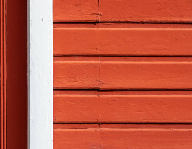 istock Red wooden siding wall with white border 1300078139