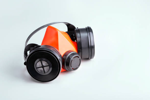 istock Respirator on grey table with place for text. Protective equipment concept. 1300080189
