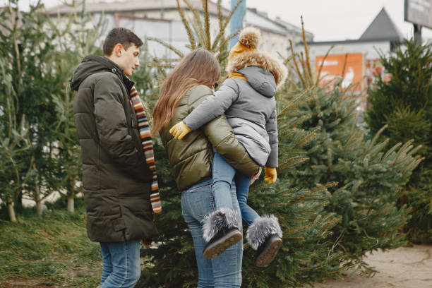 istock Family choosing a christmas tree 1300080963