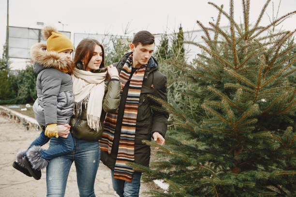 istock Family choosing a christmas tree 1300080968