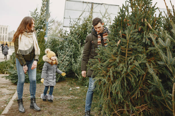 istock Family choosing a christmas tree 1300080995
