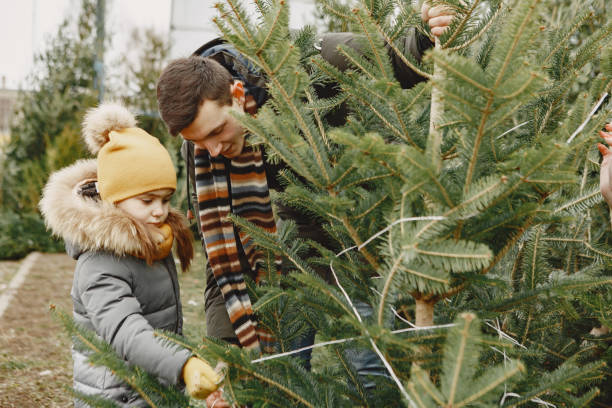 istock Family choosing a christmas tree 1300081105