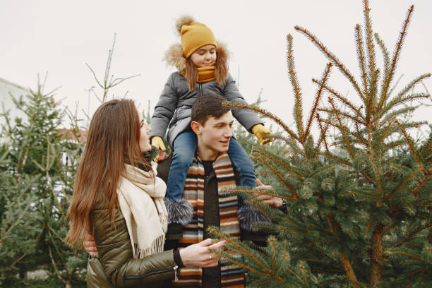 istock Family choosing a christmas tree 1300081112