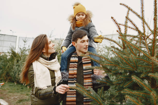 istock Family choosing a christmas tree 1300081116