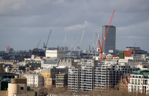 istock London downtown district with cranes rising 1300082364