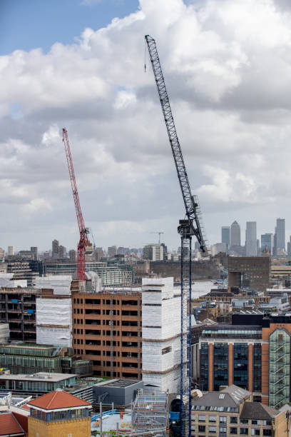 istock Cranes rising in London downtown district construction sites 1300082368
