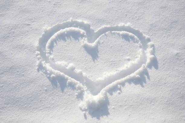 istock Hand drawn close-up sun on fresh snow. Love, Valentine's day 1300083122