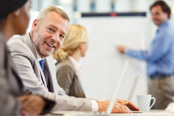 istock Happy businessman during a presentation in the office. 1300085313
