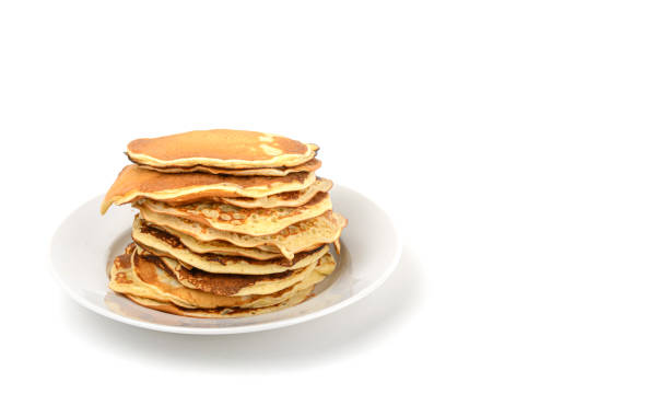 istock A stack of delicious pancakes in a plate on a white isolated background.Free space.Space for text.Horizontal view. 1300086160