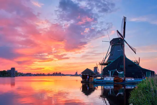 Photo of Windmills at Zaanse Schans in Holland on sunset. Zaandam, Nether