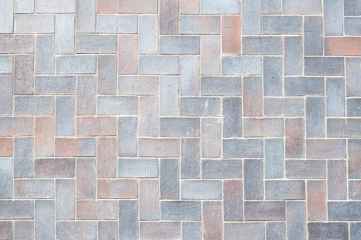 Light gray tiles texture, stone wall background. Brick pattern, floor surface. Geometric interior element. Decoration design. Abstract grunge wallpaper