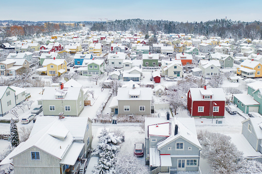 Winter in a large residential area with houses in many colors in Enskede in Stockholm municipality.