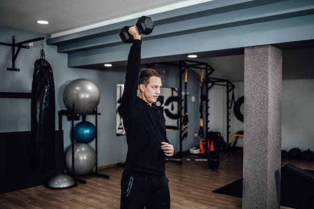 istock Small group of people working out in a gym 1300100690