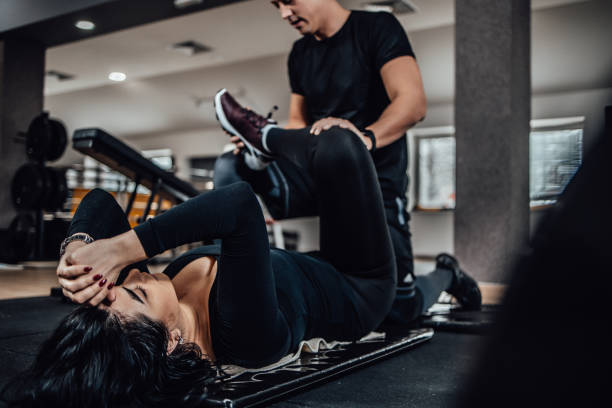 istock Small group of people working out in a gym 1300100971
