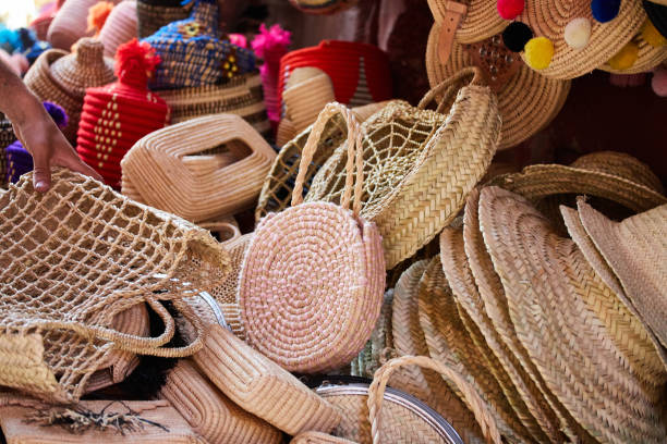 istock Straw Hats and Baskets at a Market 1300101055