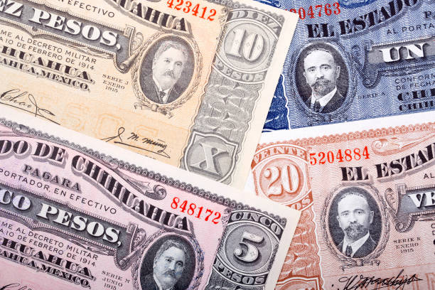 istock Old Mexican Pesos a business background 1300103462