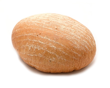 Crispy fresh whole loaf of bread on white background.