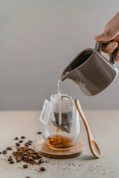 istock Pouring water to make filtered coffee 1300105217