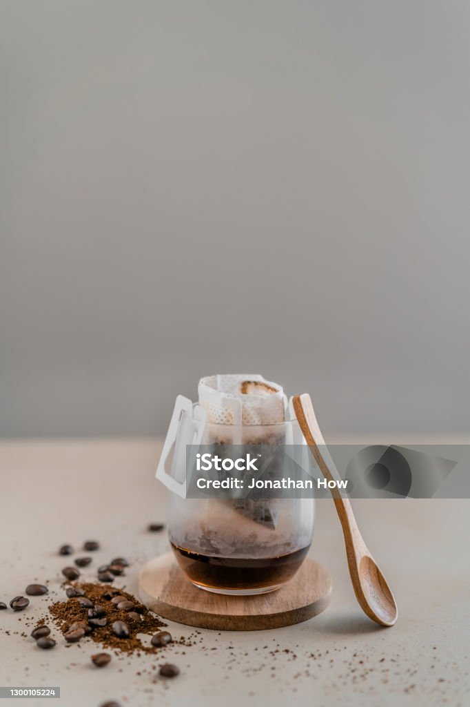 Preparing to make filtered coffee Filtered coffee being made in a glass and cup with lifestyle theme Brewed Coffee Stock Photo