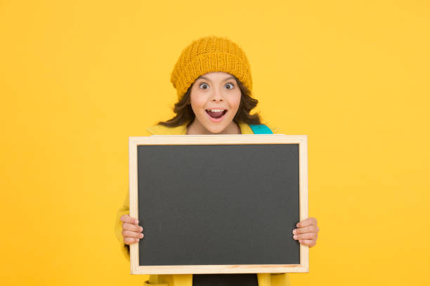 istock Such a great opportunity. School announcement concept. Changes in school life. School schedule information. Modern schoolgirl with chalkboard. School girl cute pupil hold blackboard copy space 1300106104