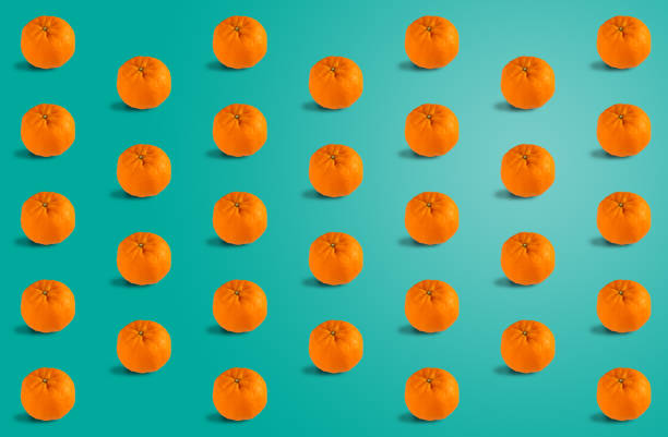 Fruit seamless pattern of fresh orange tangerine or mandarin on blue background. Orange Chinese New Year Seamless Pattern.