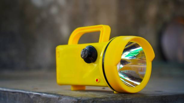 Electronic Super Bright LED Flashlight with yellow color for Emergency Traffic or Parking Arrangement Tools. stock photo