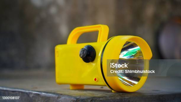 Electronic Super Bright Led Flashlight With Yellow Color For Emergency Traffic Or Parking Arrangement Tools Stock Photo - Download Image Now
