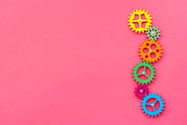 Working gears connect into puzzle, top view. Teamwork and collaboration concept.