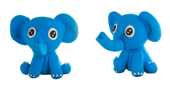 blue cute plasticine elephant in sit action on white isolate background
