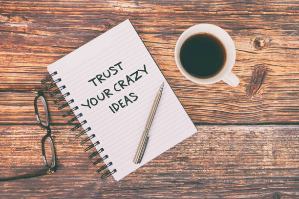 istock Inspirational Quotes On Note Pad - Trust you crazy ideas. Retro Style 1300111919
