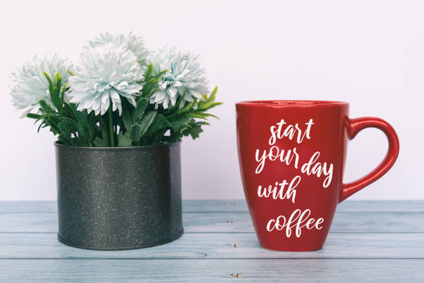 istock Inspirational Quotes on Red Coffee Cup - Start Your Day With Coffee 1300111959