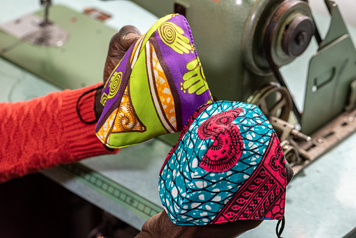 handcrafted facemasks produced by an African tailor, with traditional Senegalese wax fabric, an example of a small entrepreneur who produces anti-coronavirus sanitary protections