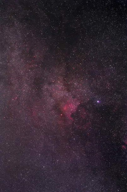 North America nebula in Milky Way photographed with long exposure through a telescope.