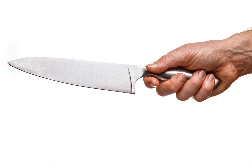 Big knife in the hands of a cook on a white background isolate