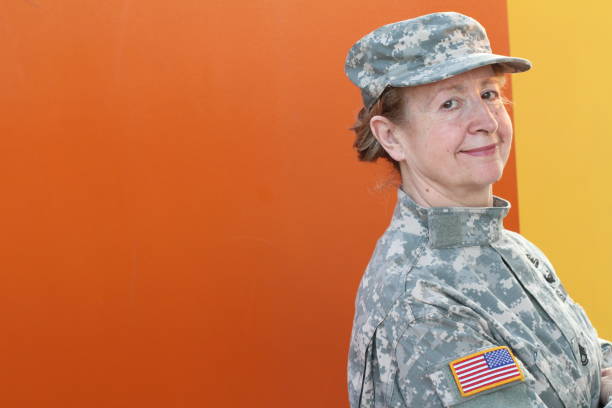 istock Middle aged veteran army female soldier 1300113327