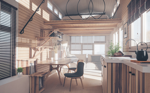Diseño interior rústico de la pequeña casa con cocina, sala de estar y dormitorio en el piso del entresuelo en la luz cálida del atardecer. Renderizado en 3D. photo
