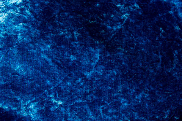 istock dark blue velvety fabric background 1300113716