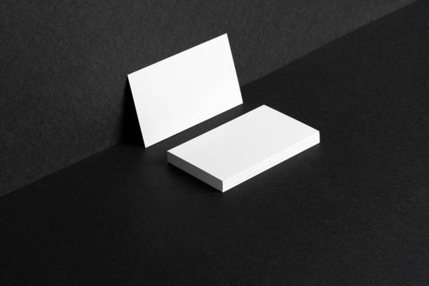 istock White businesscards on black background close up 1300115042