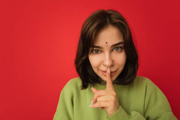 istock Caucasian woman's portrait isolated on red studio background with copyspace 1300117937