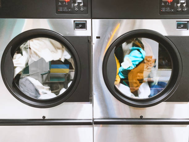 istock Large laundromats cleaning clothes 1300118459