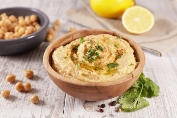 istock hummus with olive oil and herbs 1300121048