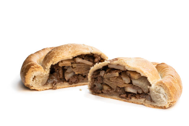 istock Halved puff pastry meat pie isolated on white background 1300122858