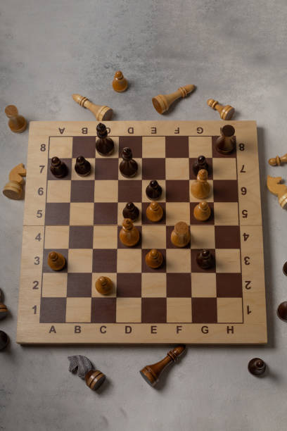 istock Pat in a chess game on a light background 1300122874