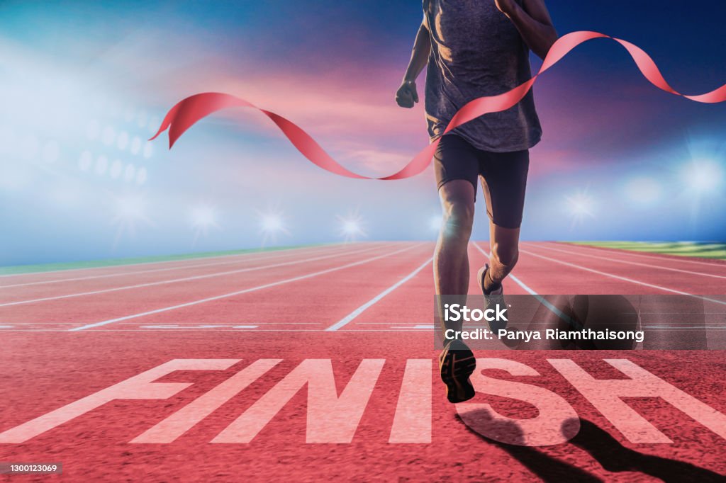 Runners running towards the finish line. Runners running towards the finish line. Success concept. Finish Line Stock Photo