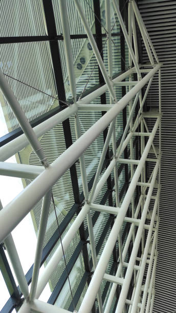 istock Internal metal and glass structure of the building. Modern Architecture. Structural glass facade of office building or airport. Modern architecture with glass windows. 1300123879